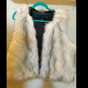 White with a touch of black fur vest